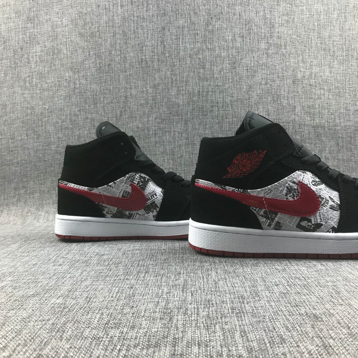 Air Jordan 1 Mid Sneakers in Black Red 852542-061 - product image from the listing.