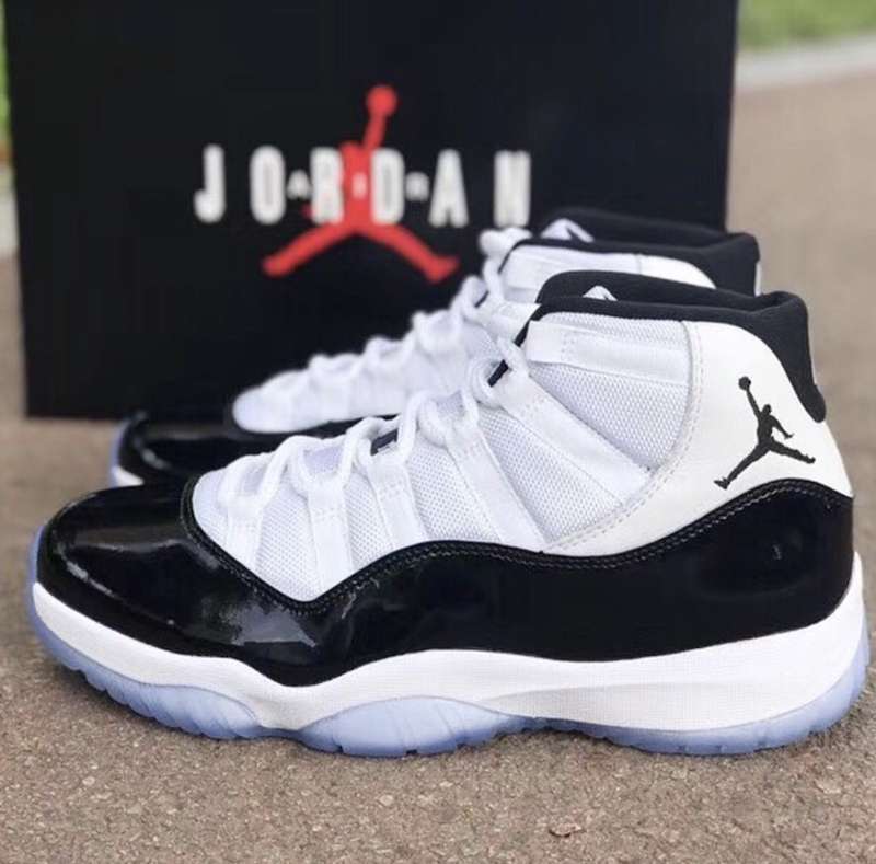 Air Jordan 11 Concord Black White Sneakers - product image from the listing.