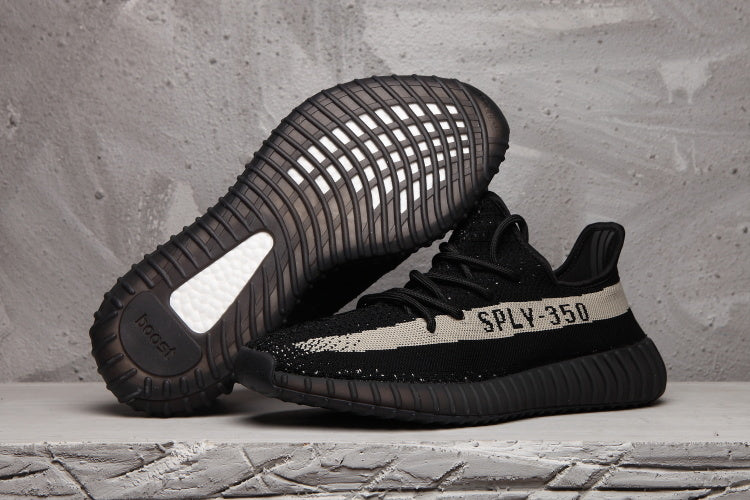 Yeezy 350 V2 Sneakers in Black and Cream Knit - product image from the listing.