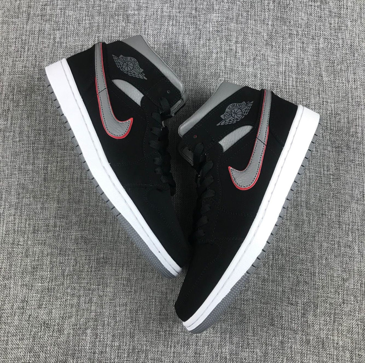 Air Jordan 1 Mid Sneakers in Black Grey Red 554724-060 - product image from the listing.