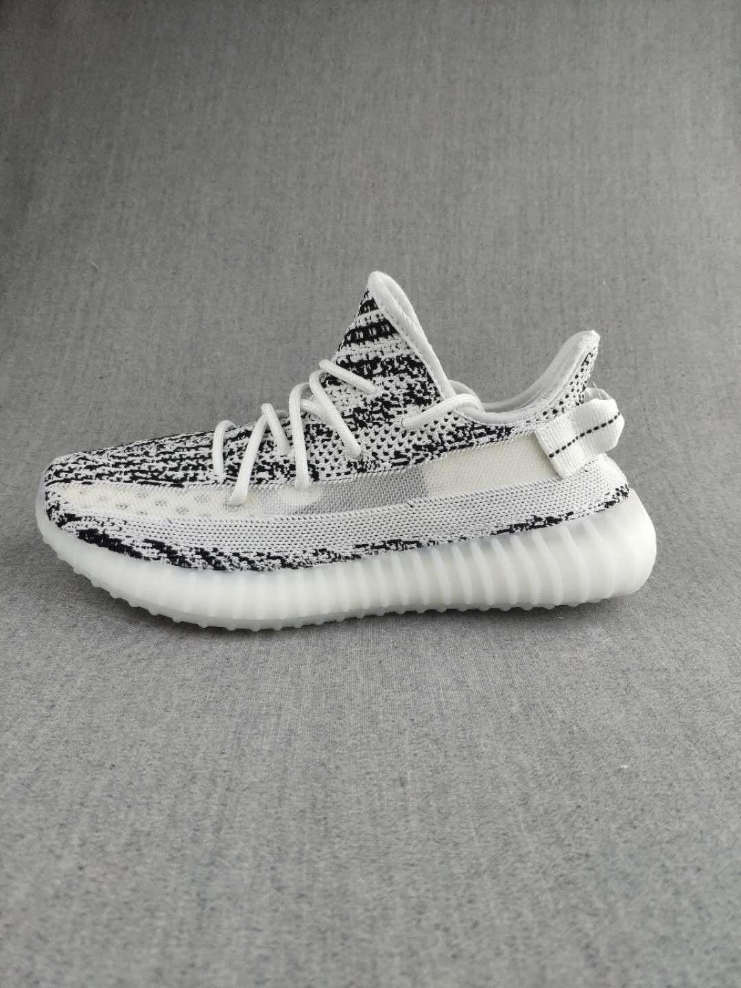 Black and White Yeezy 350 V2 Knit Sneakers - product image from the listing.