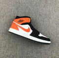 Air Jordan 1 Mid Sneakers in Black White Orange 554724-058 - product image from the listing.