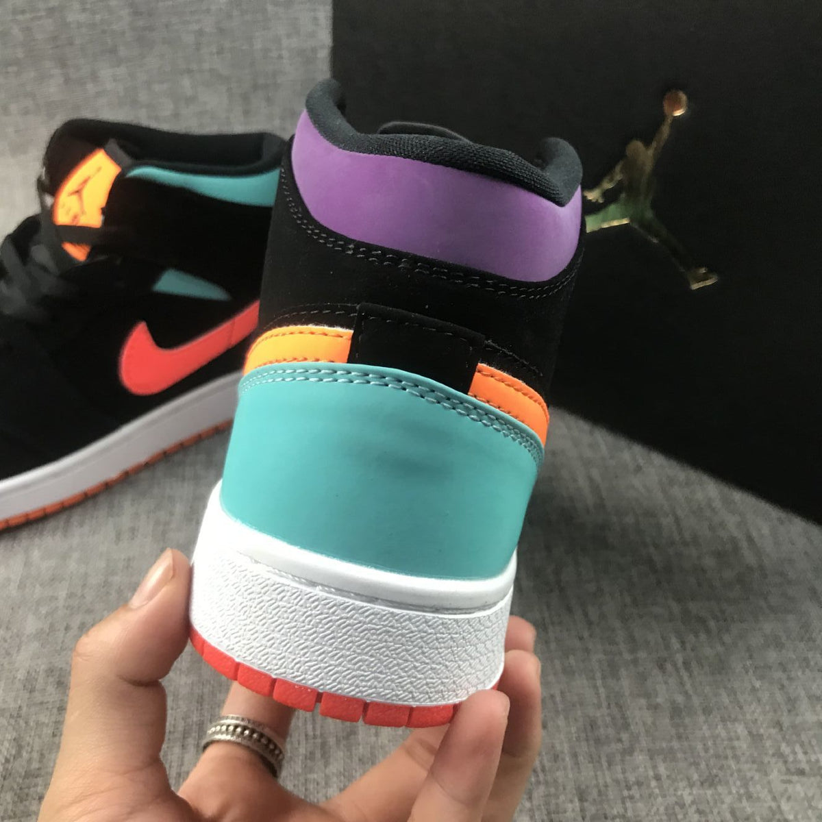 Jordan 1 Mid Sneakers in Multicolor Black 554725-083 - product image from the listing.