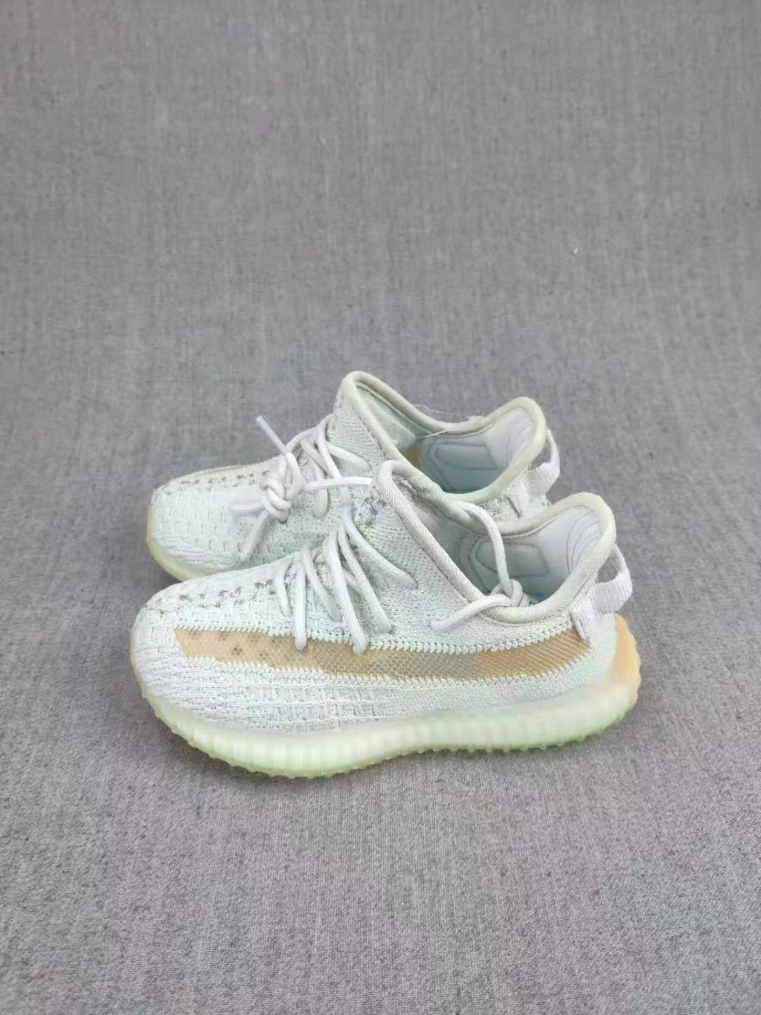Yeezy Boost 350 V2 Kids Sneakers, in Light Neutral - product image from the listing.