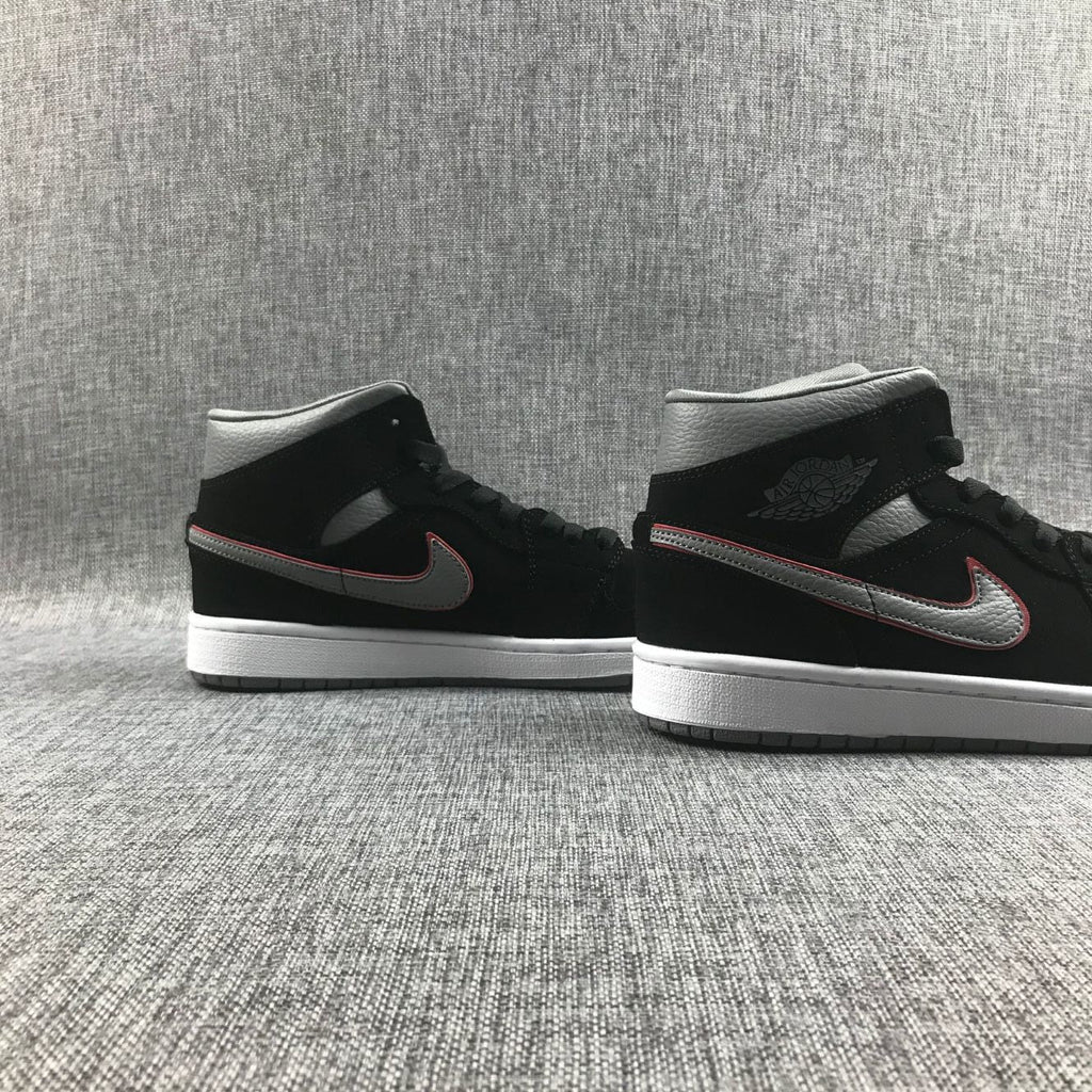 Air Jordan 1 Mid Sneakers in Black Grey Red 554724-060 - product image from the listing.