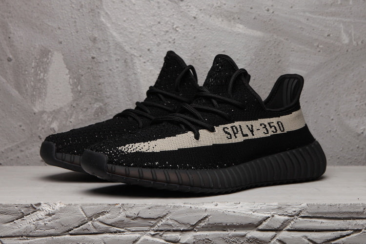 Yeezy 350 V2 Sneakers in Black and Cream Knit - product image from the listing.