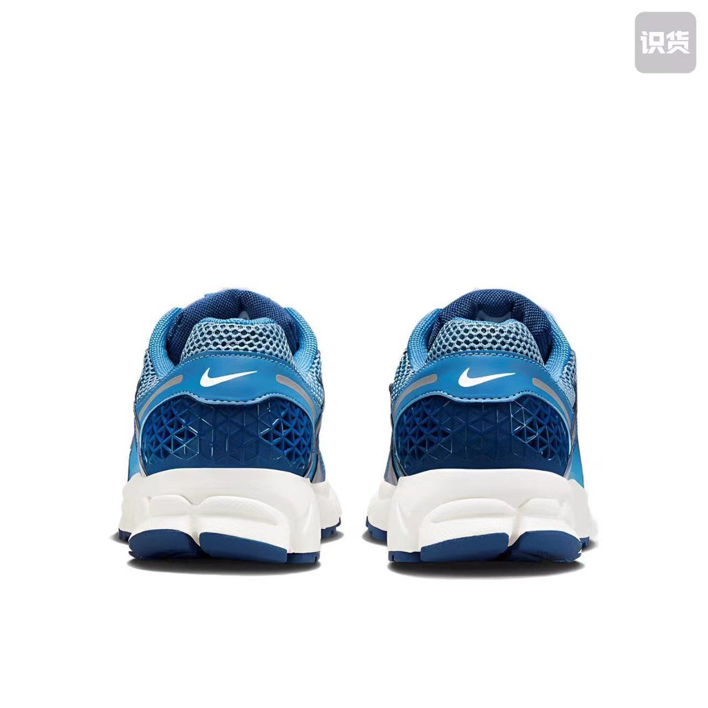 Nike Zoom Vomero 5 Sneakers in White Blue Silver - product image from the listing.