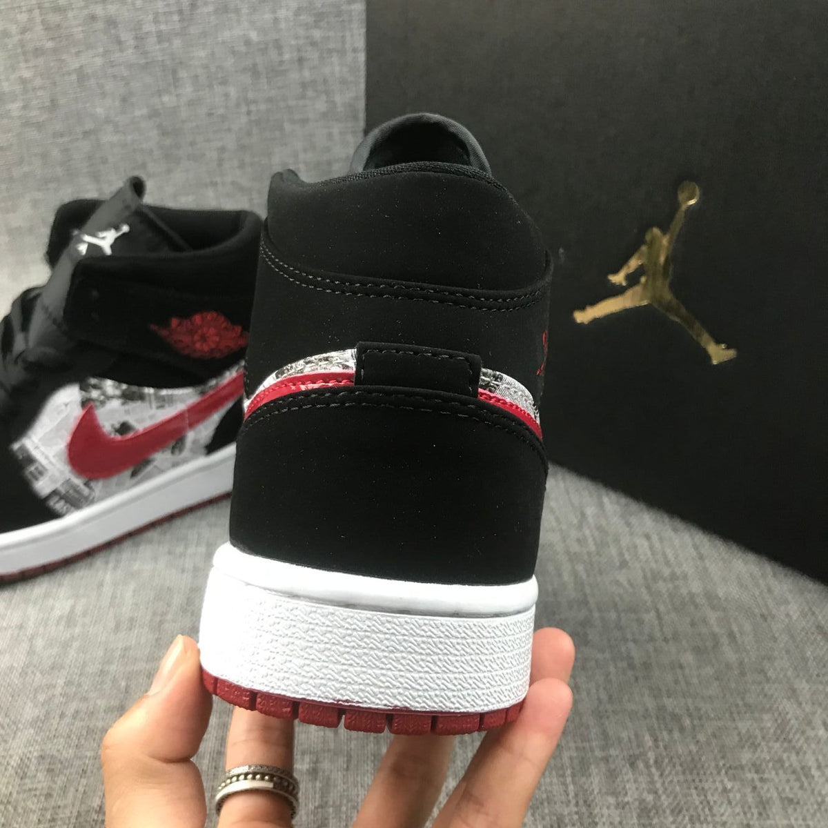 Air Jordan 1 Mid Sneakers in Black Red 852542-061 - product image from the listing.