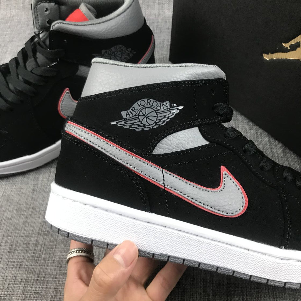 Air Jordan 1 Mid Sneakers in Black Grey Red 554724-060 - product image from the listing.