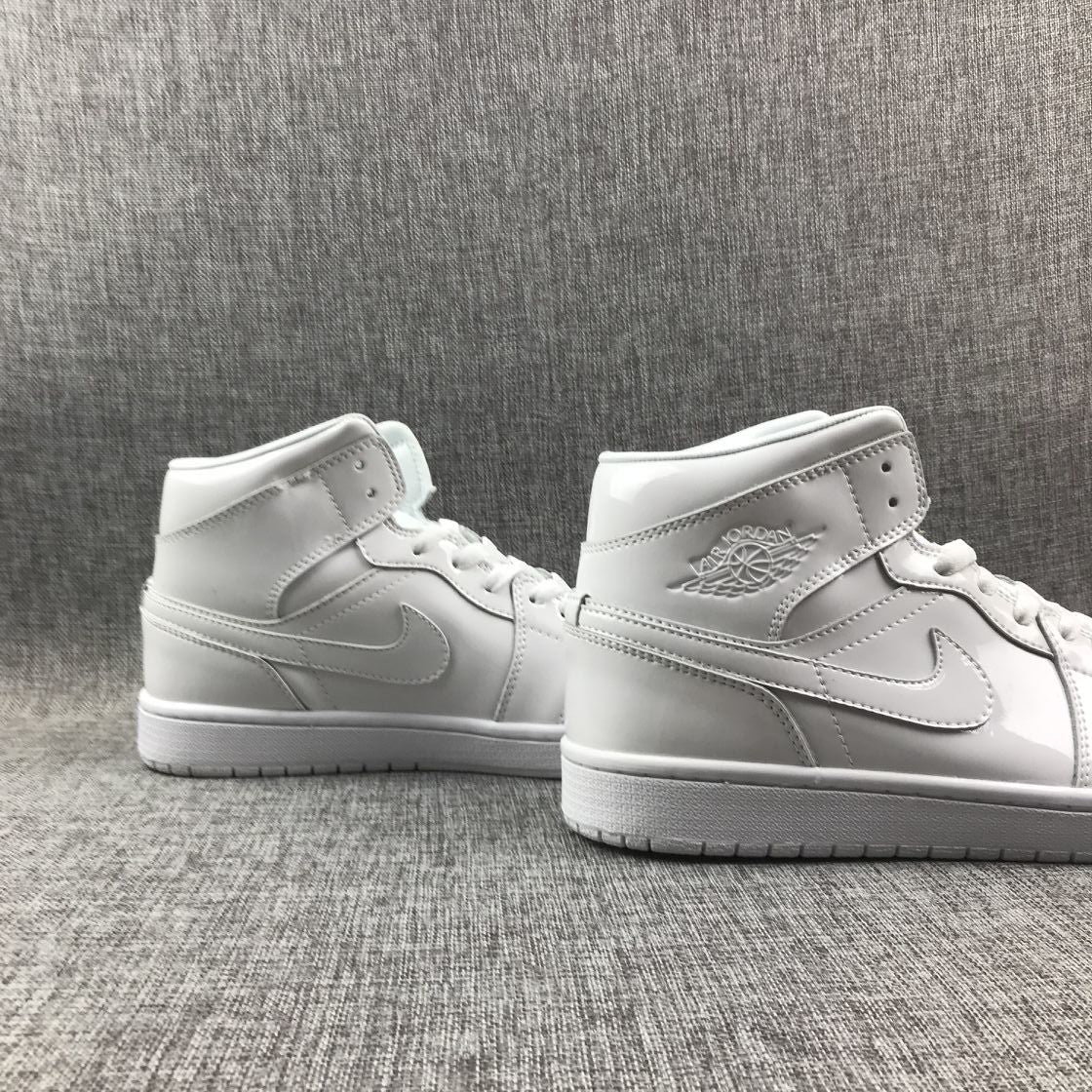 Air Jordan 1 Mid White Patent-Style Sneakers BQ6472-111 - product image from the listing.