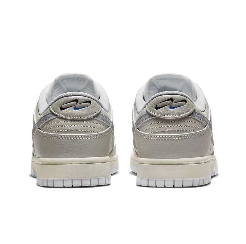 Nike Dunk Low Sneakers in Metallic Silver DX3197-095 - product image from the listing.