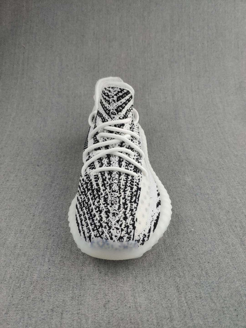 Black and White Yeezy 350 V2 Knit Sneakers - product image from the listing.