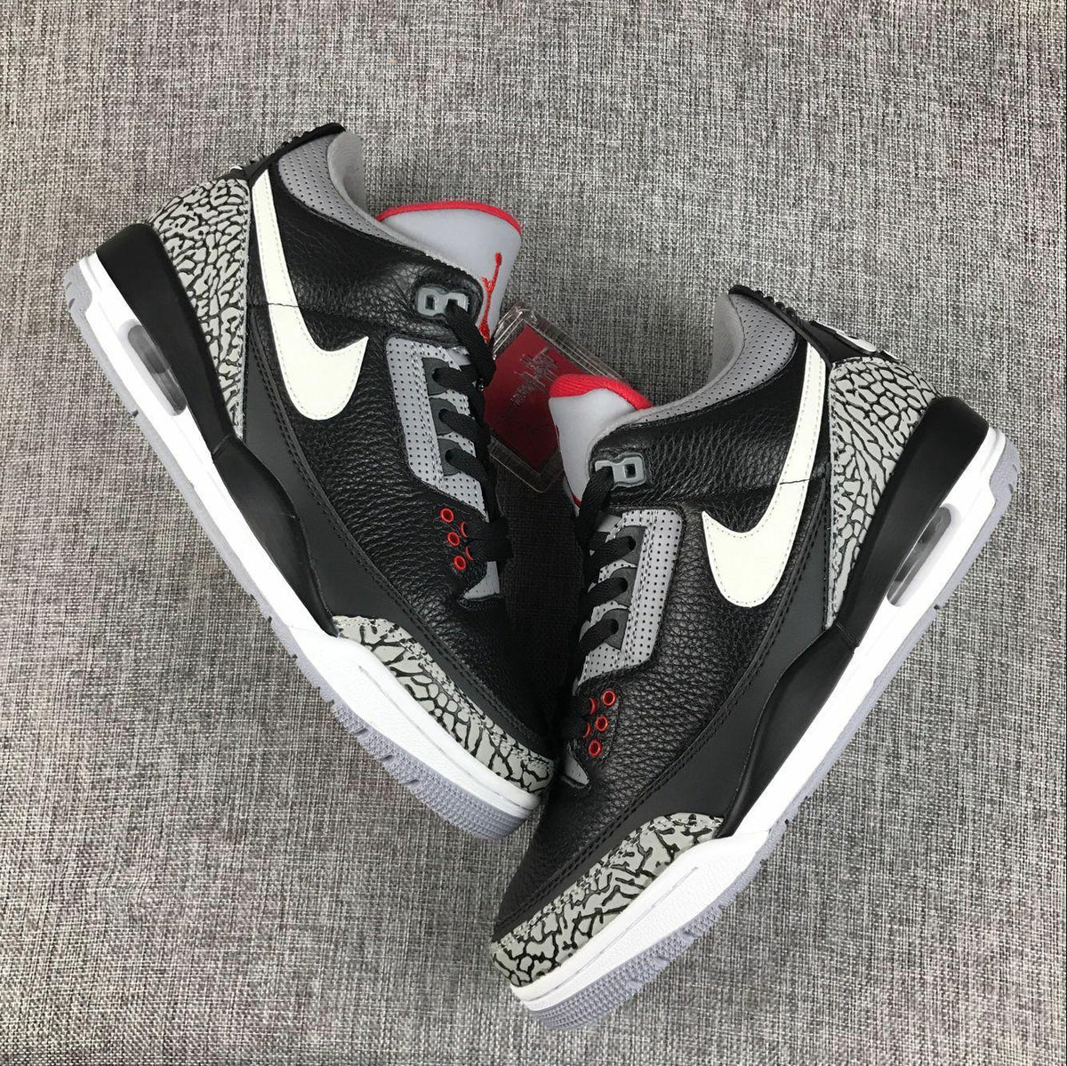 Air Jordan 3 Retro Black Cement Sneakers, in Black and Grey - product image from the listing.