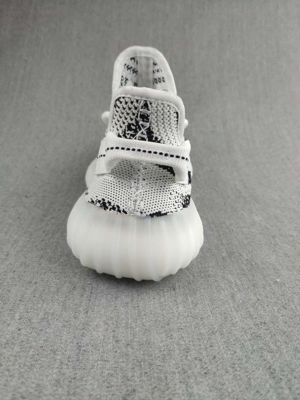 Black and White Yeezy 350 V2 Knit Sneakers - product image from the listing.