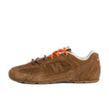 New Balance Brown Low-Cut Sneakers with Orange Laces - product image from the listing.