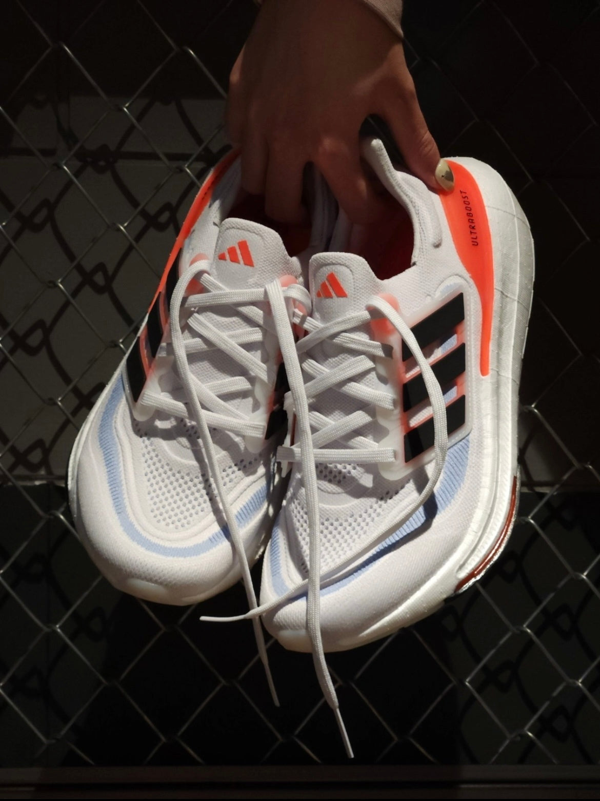 Adidas Ultraboost 23 Running Shoes in White Black Orange HQ6351 - product image from the listing.
