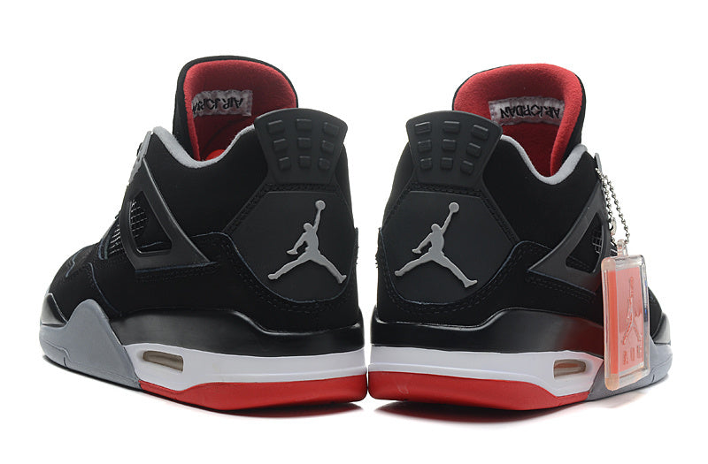 Jordan 4 Retro Basketball Shoes in Black/Red - product image from the listing.