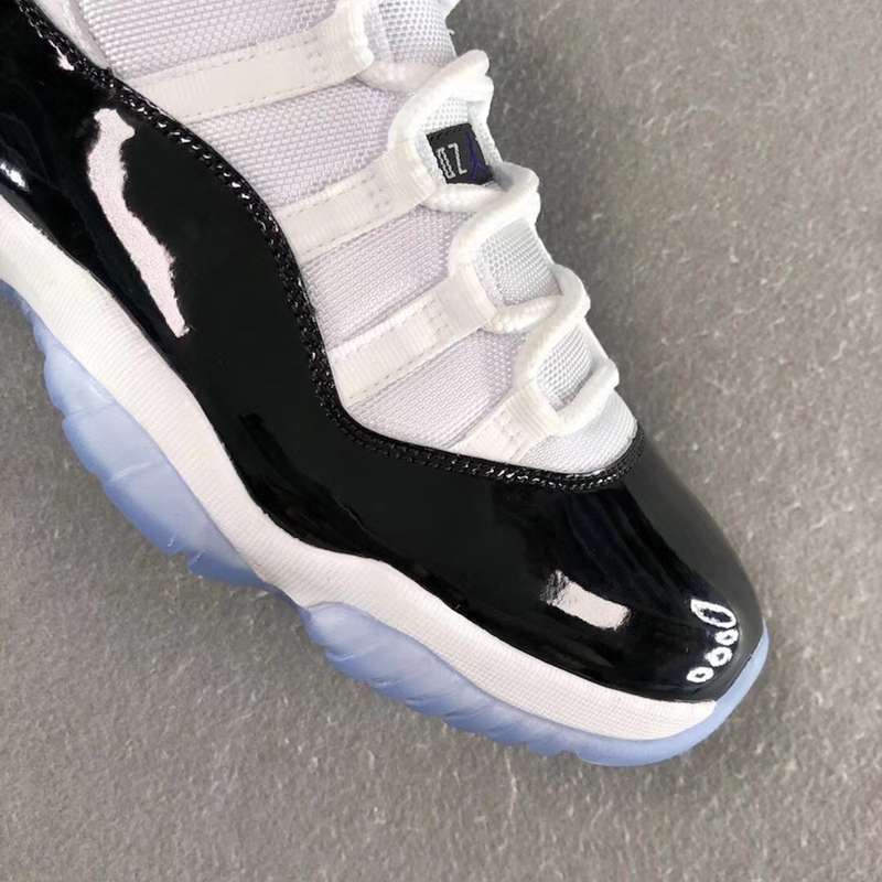 Air Jordan 11 Concord Black White Sneakers - product image from the listing.