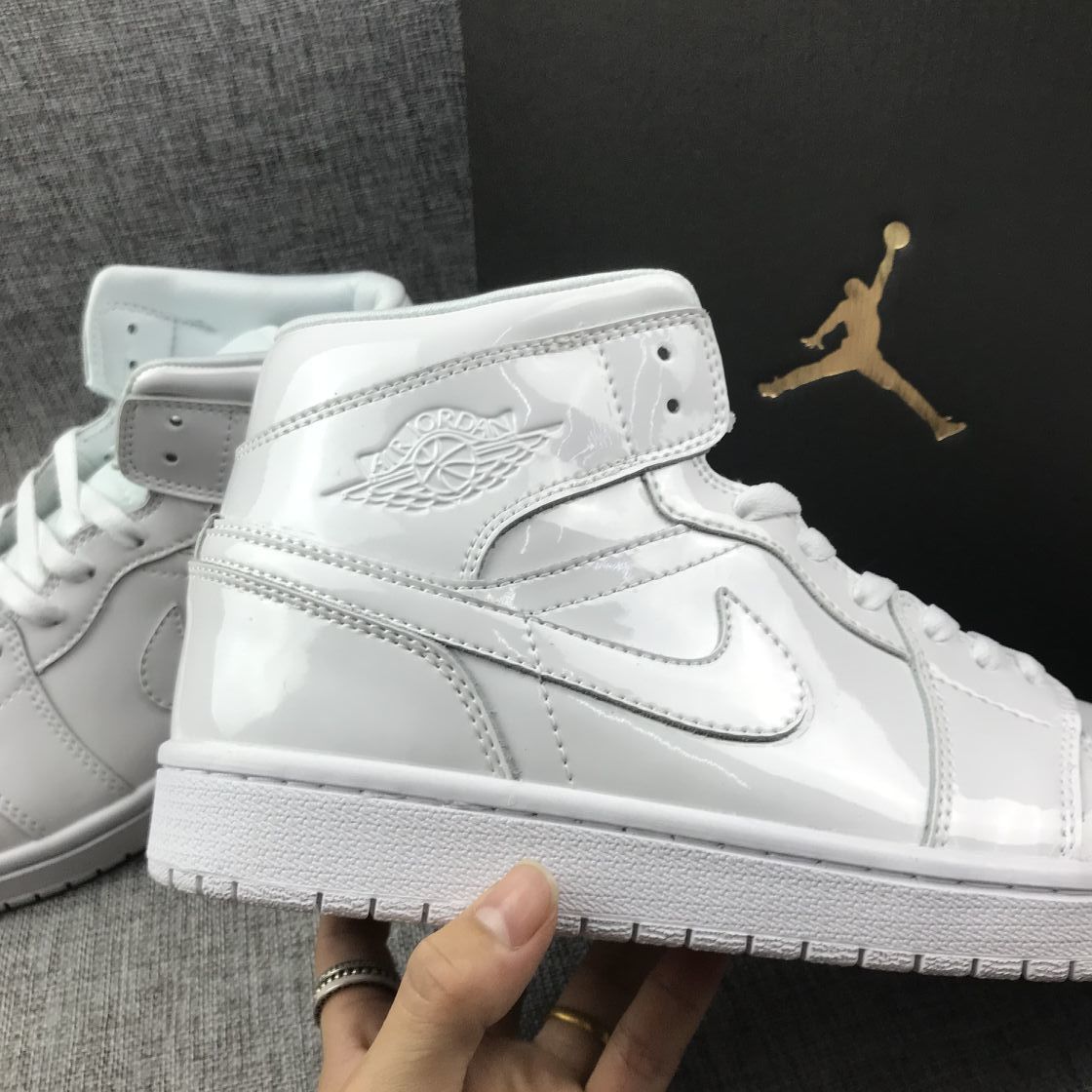 Air Jordan 1 Mid White Patent-Style Sneakers BQ6472-111 - product image from the listing.