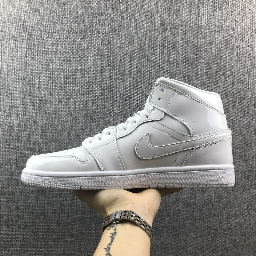Air Jordan 1 Mid White Patent-Style Sneakers BQ6472-111 - product image from the listing.