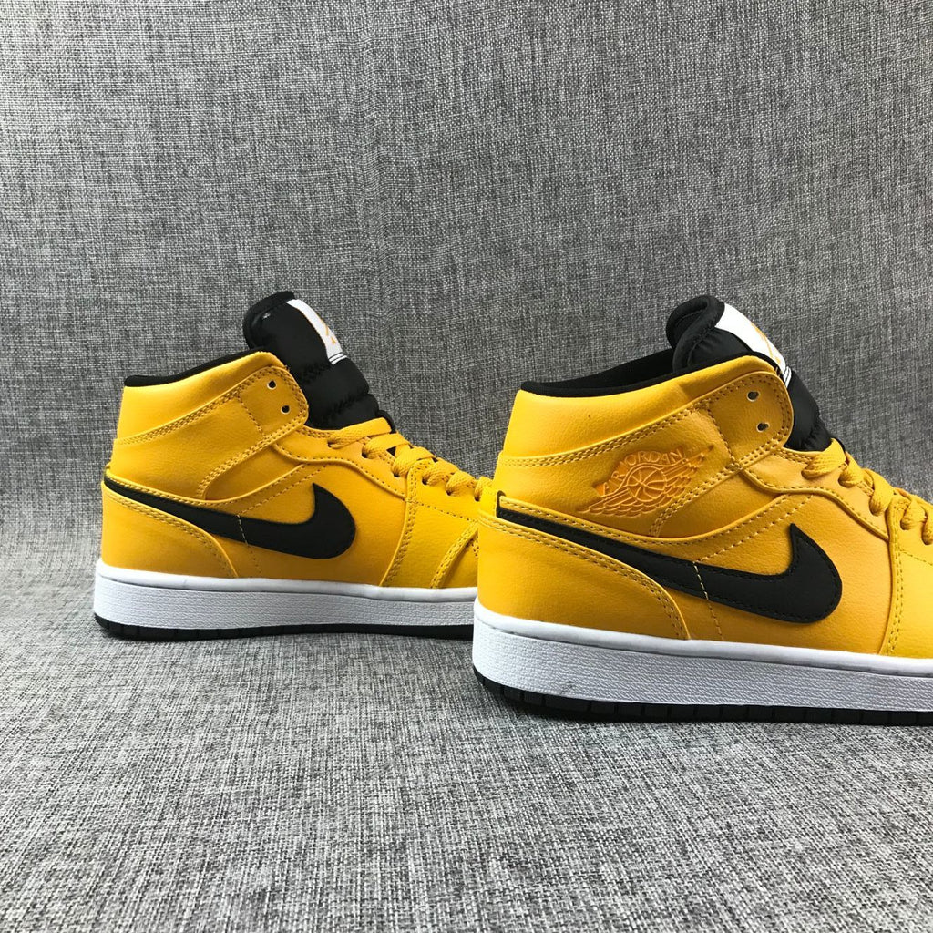 Air Jordan 1 Mid Sneakers in University Gold Black White - product image from the listing.