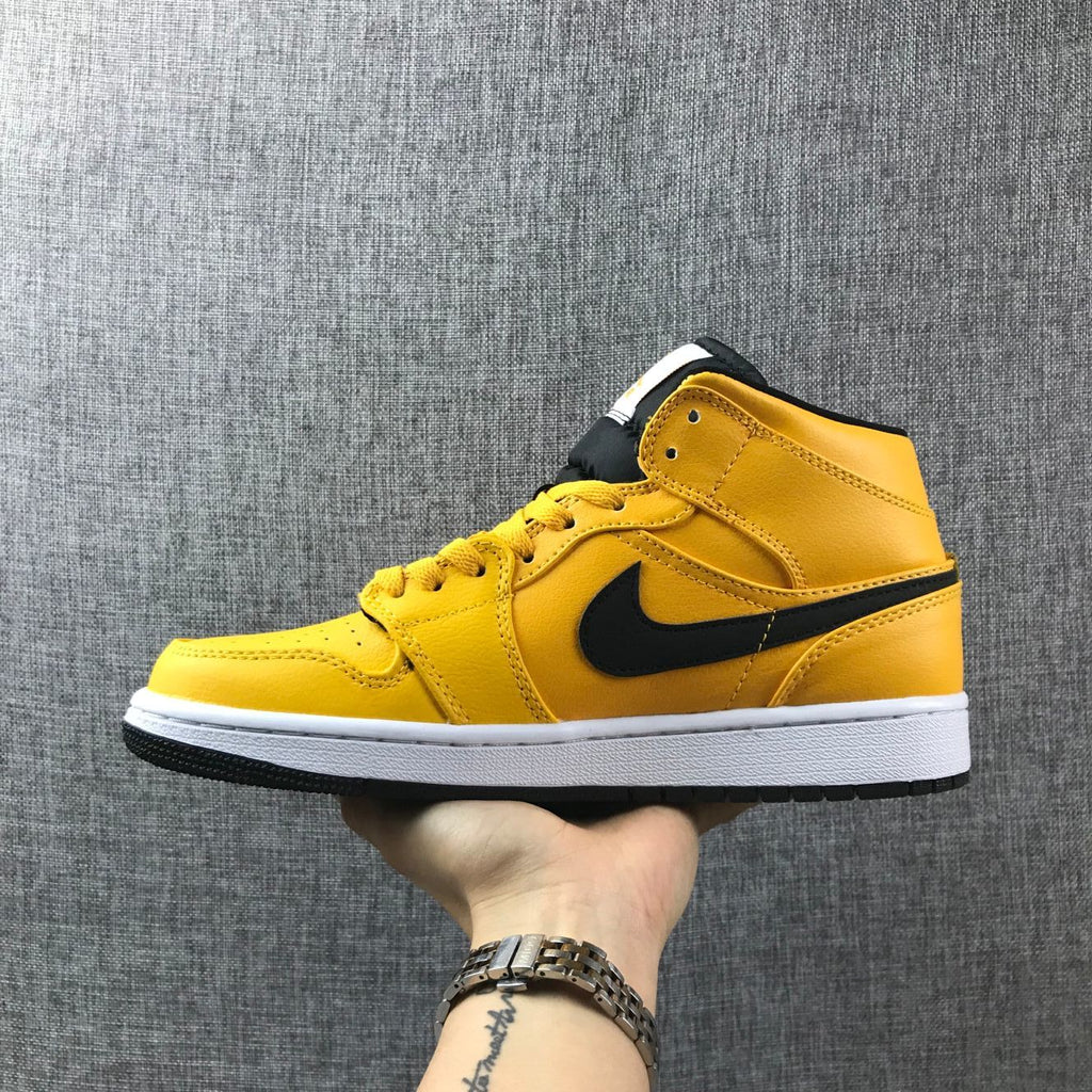 Air Jordan 1 Mid Sneakers in University Gold Black White - product image from the listing.