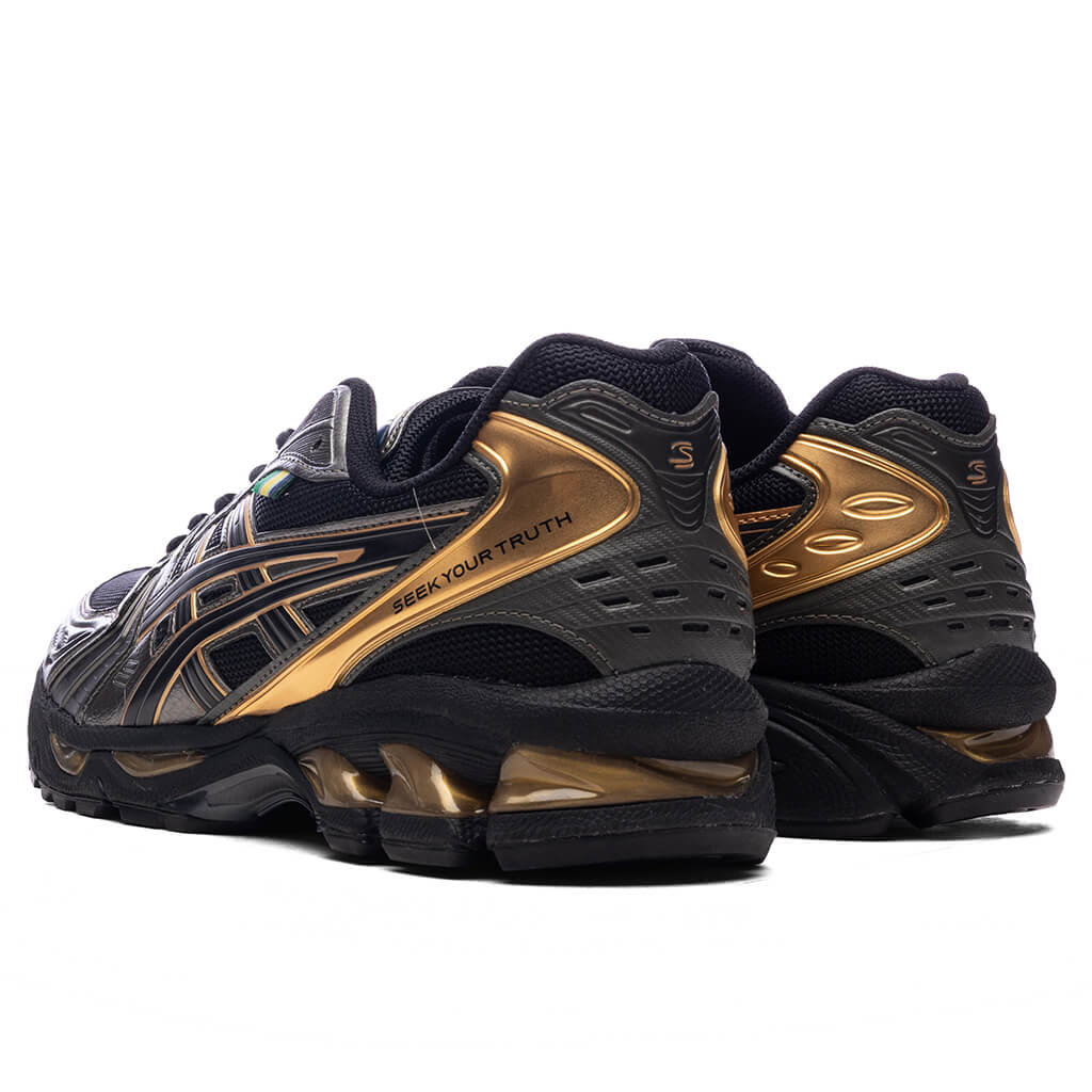 Asics x Ayrton Senna Gel-Kayano 14 in Black/Pure Gold - product image from the listing.