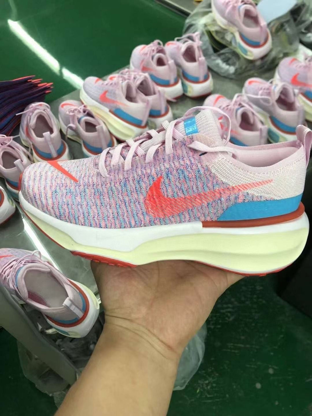 Women's Nike ZoomX Invincible Run Flyknit 3 Road Running Shoes Pink - product image from the listing.