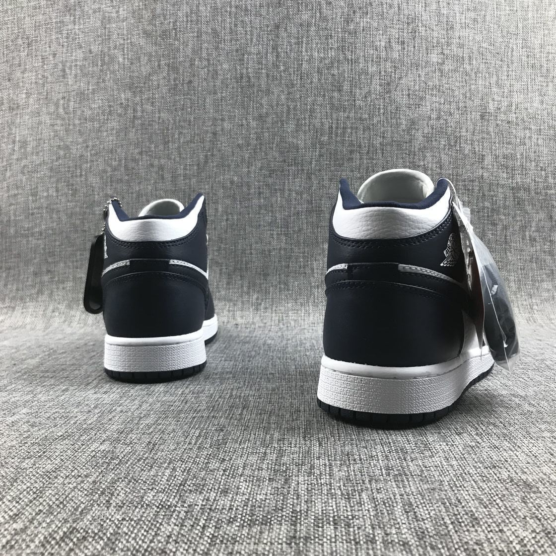 What The Obsidian Sneakers - Jordan 1 Mid 554724-174 - product image from the listing.