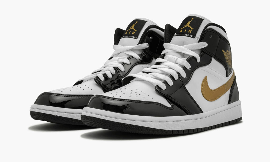Air Jordan 1 Mid SE Black Gold Patent in Leather - product image from the listing.