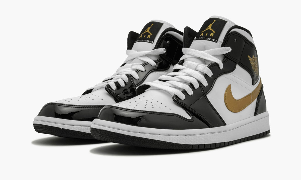 Air Jordan 1 Mid SE Black Gold Patent in Leather - product image from the listing.