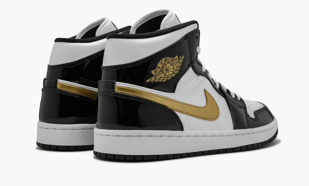 Air Jordan 1 Mid SE Black Gold Patent in Leather - product image from the listing.
