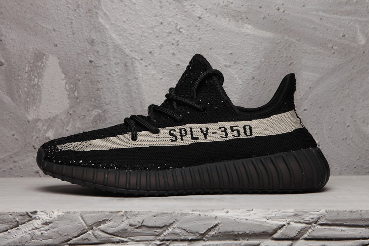 Yeezy 350 V2 Sneakers in Black and Cream Knit - product image from the listing.