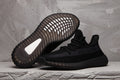 Yeezy Boost 350 V2 Sneakers in Black Knit - product image from the listing.