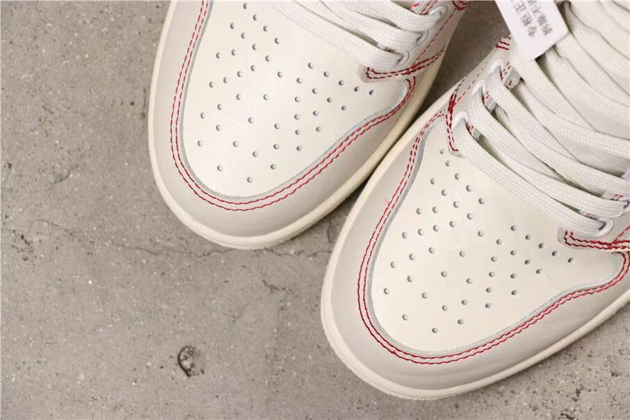 Air Jordan 1 Retro High OG Sneakers in White and Red - product image from the listing.