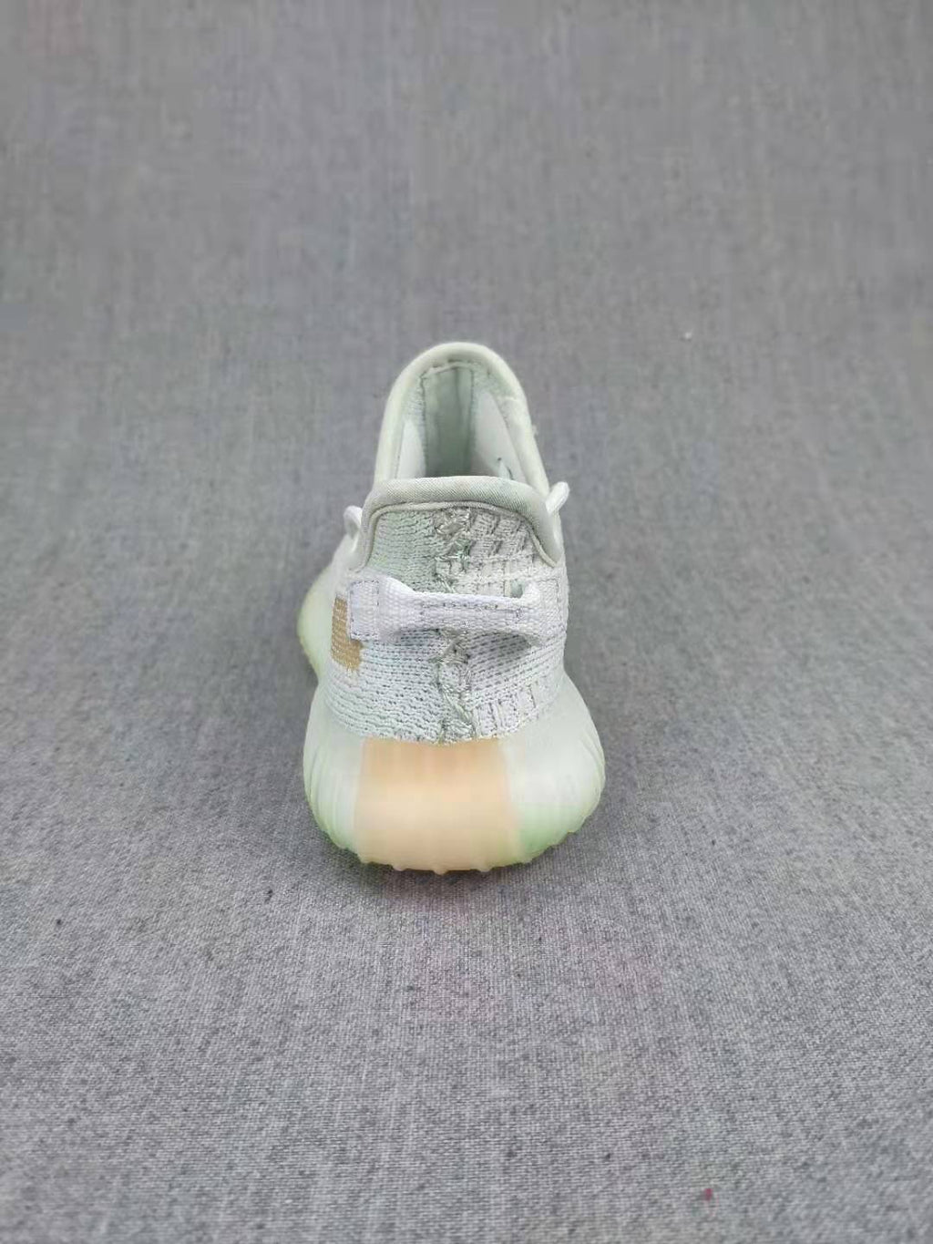 Yeezy Boost 350 V2 Kids Sneakers, in Light Neutral - product image from the listing.