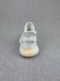 Yeezy Boost 350 V2 Kids Sneakers, in Light Neutral - product image from the listing.