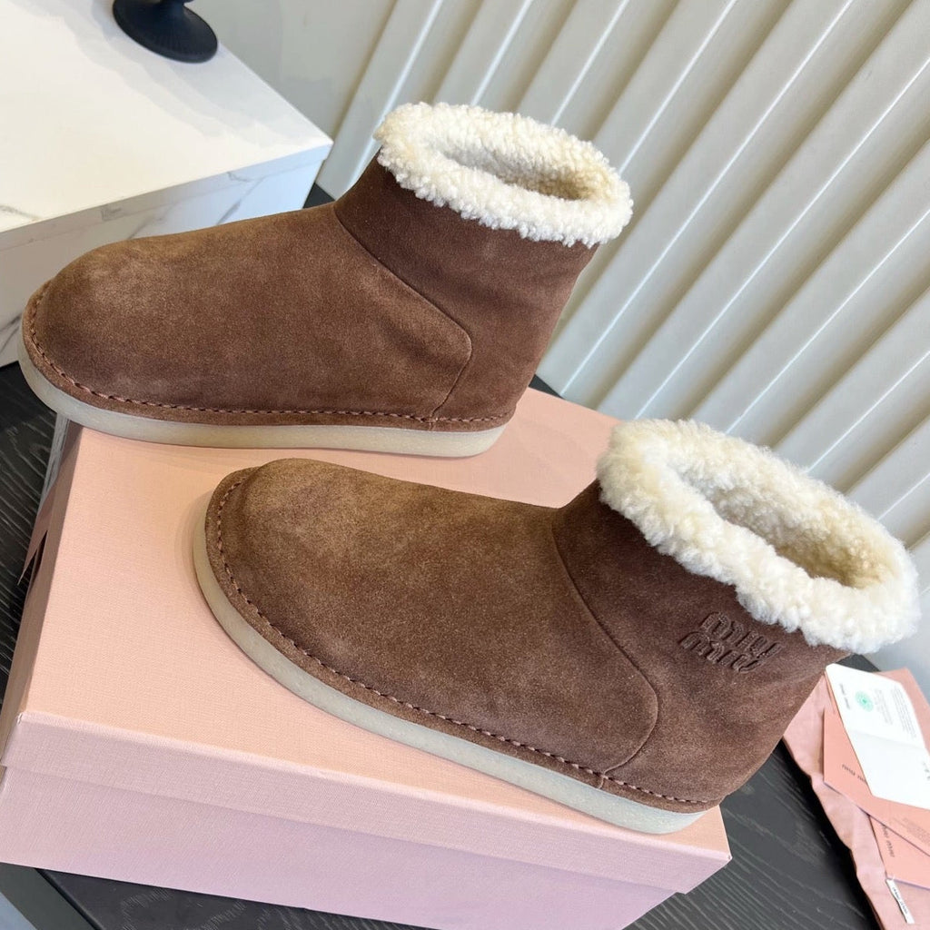 2026 Snow Ankle Boots Suede 977010 by Miu Miu - product image from the listing.