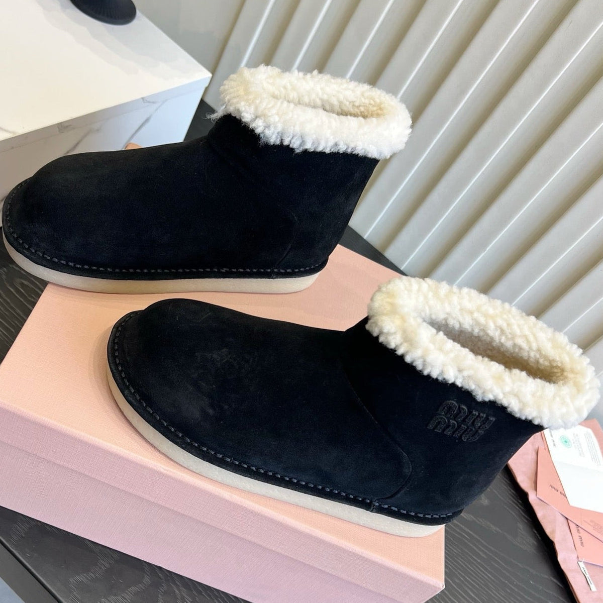 2026 Snow Ankle Boots Suede 977010 by Miu Miu - product image from the listing.