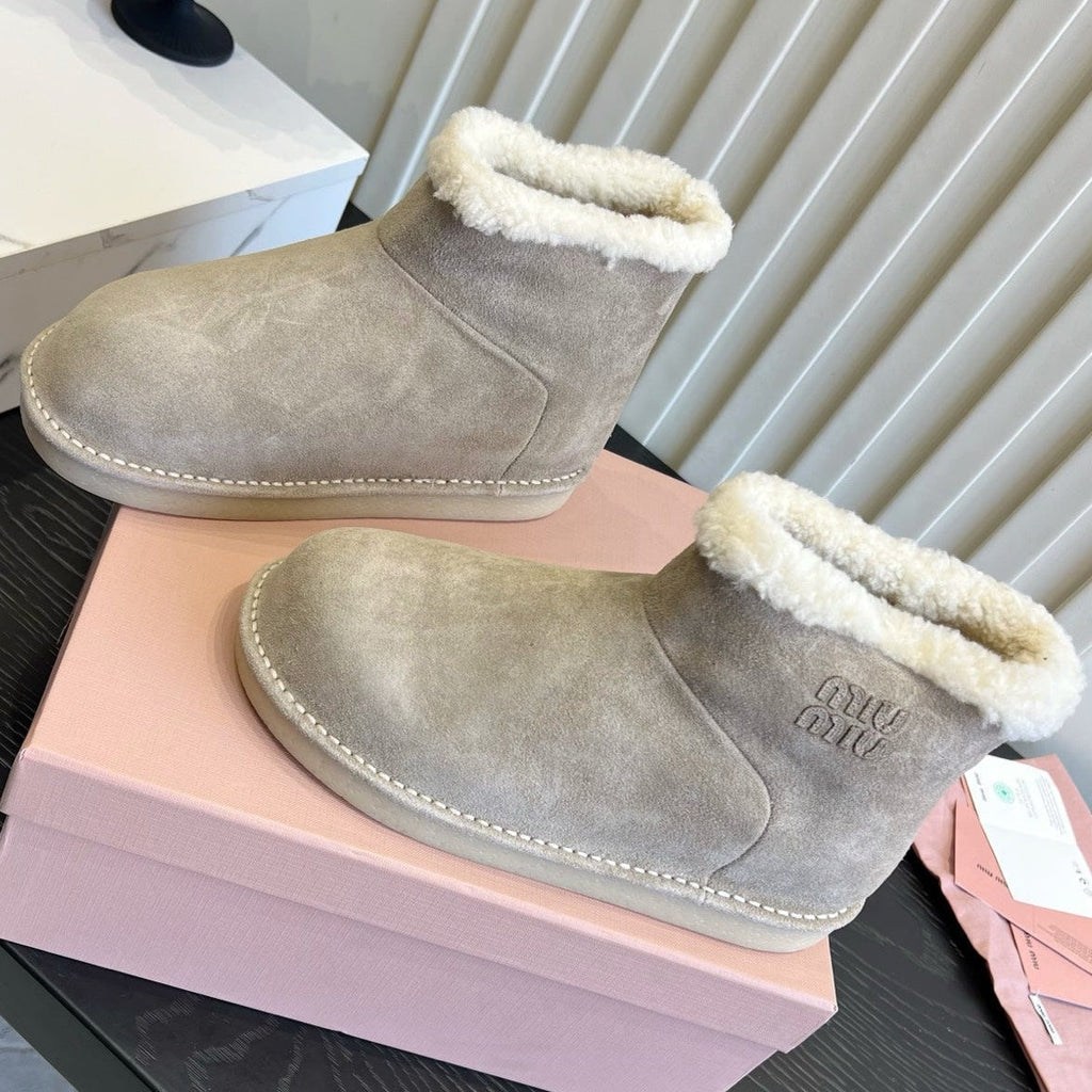 2026 Snow Ankle Boots Suede 977010 by Miu Miu - product image from the listing.