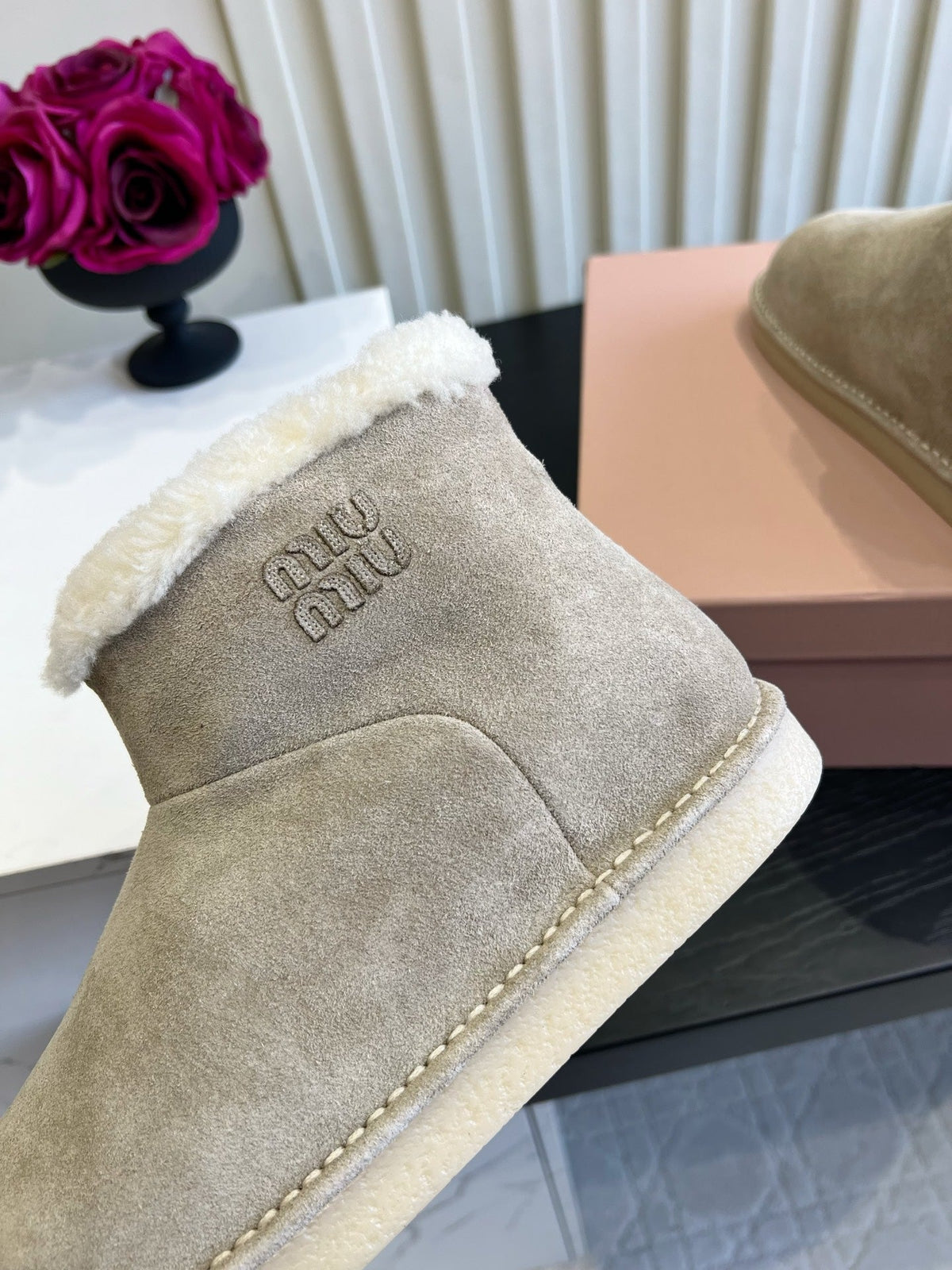 2026 Snow Ankle Boots Suede 977010 by Miu Miu - product image from the listing.