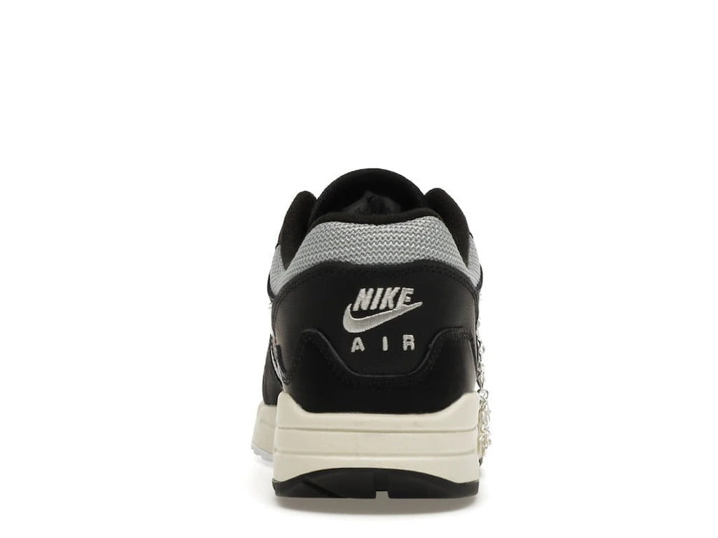 with Bracelet - Nike Air Max 1 Patta Waves Black - product image from the listing.