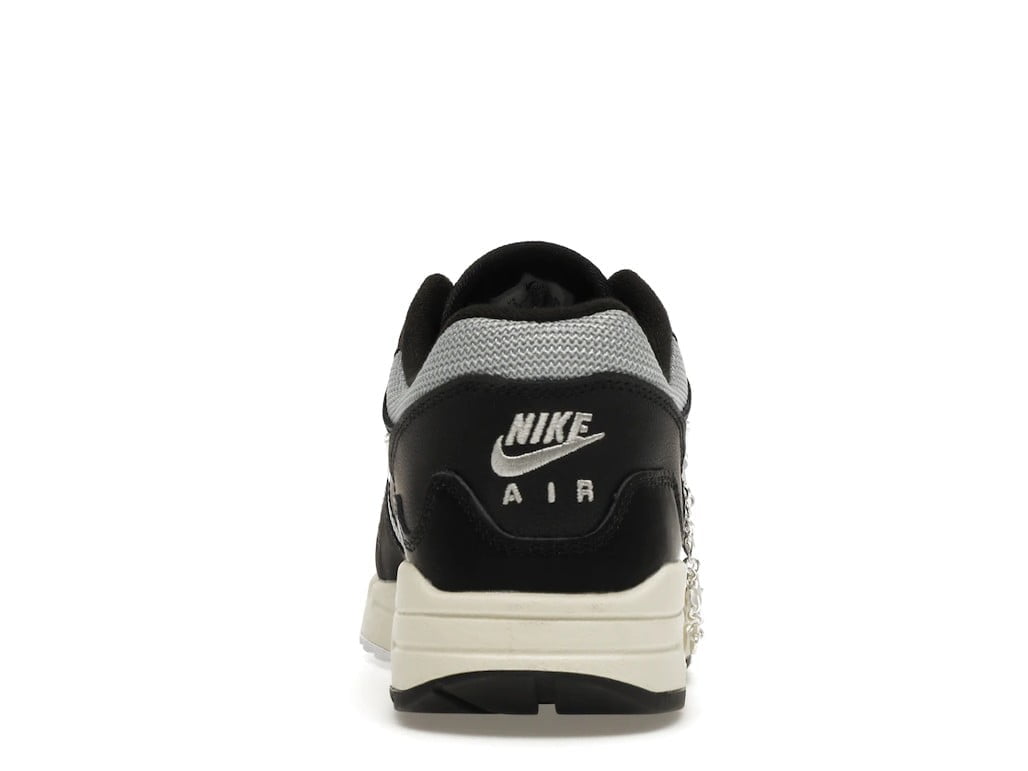 with Bracelet - Nike Air Max 1 Patta Waves Black - product image from the listing.